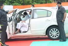 VK Pandian driving Naveen Patnaik to I-Day Flag Hosting Venue Draws Mixed Response